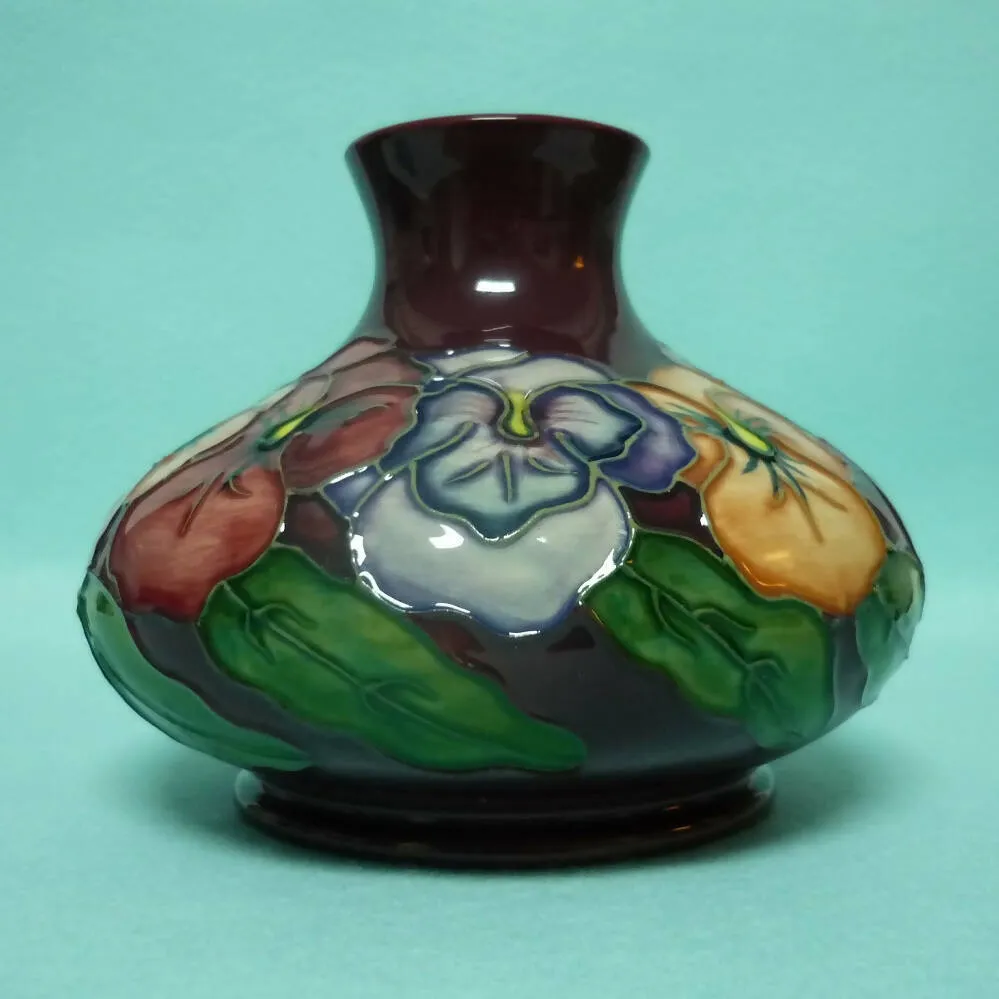 A Moorcroft Squat Vase (Dia 5.23") in the Pansy Design by Rachel Bishop