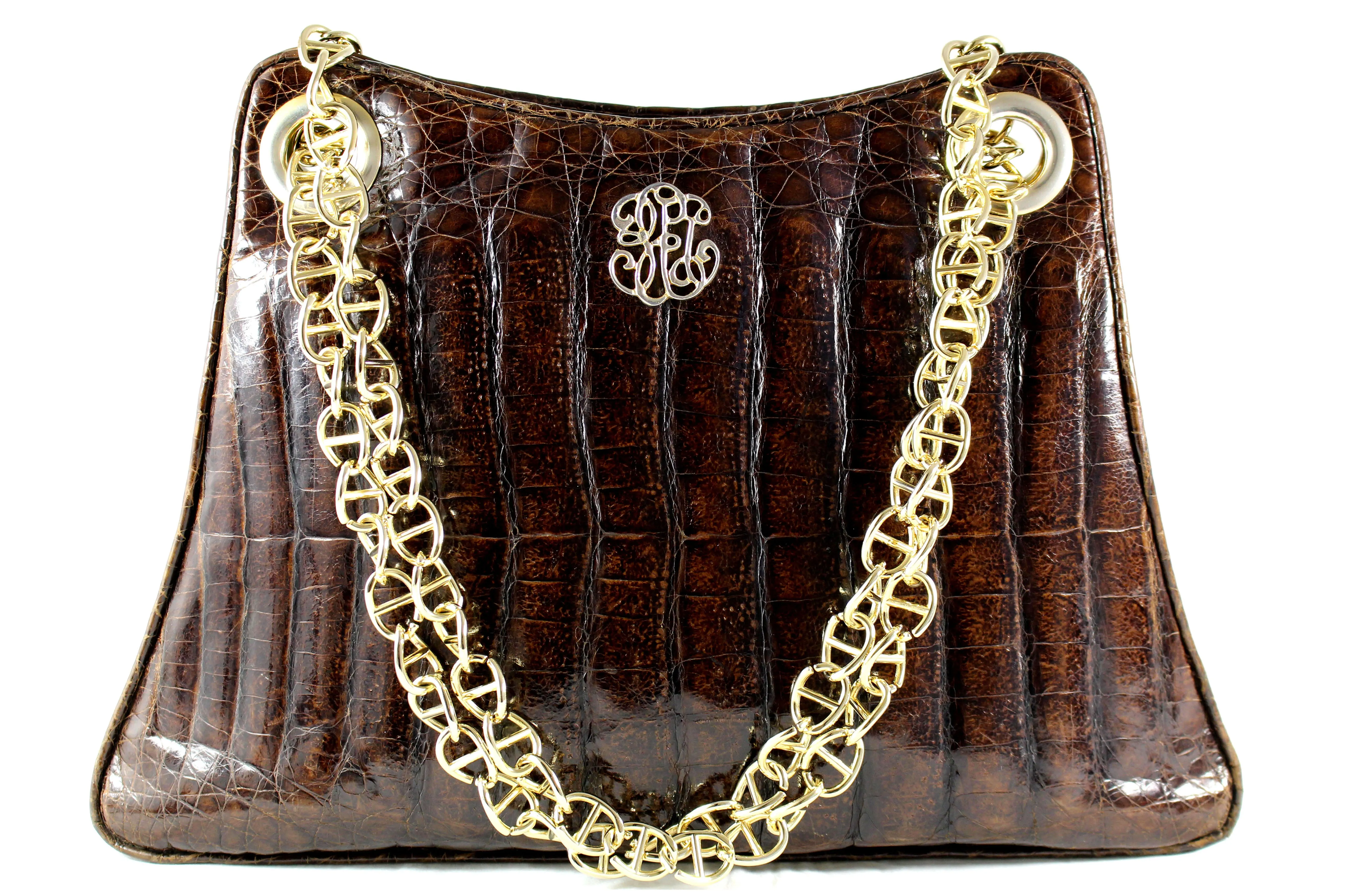 Large brown crocodile skin handbag with chain handle